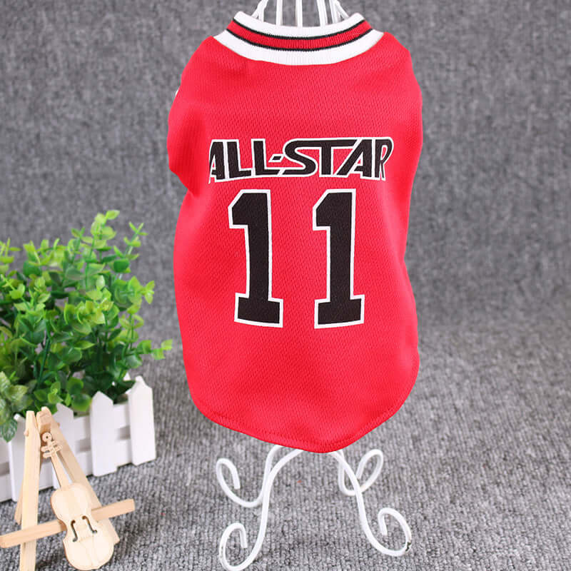 Red pet jersey with 'All-Star 11' text on a stand with a plant in the background