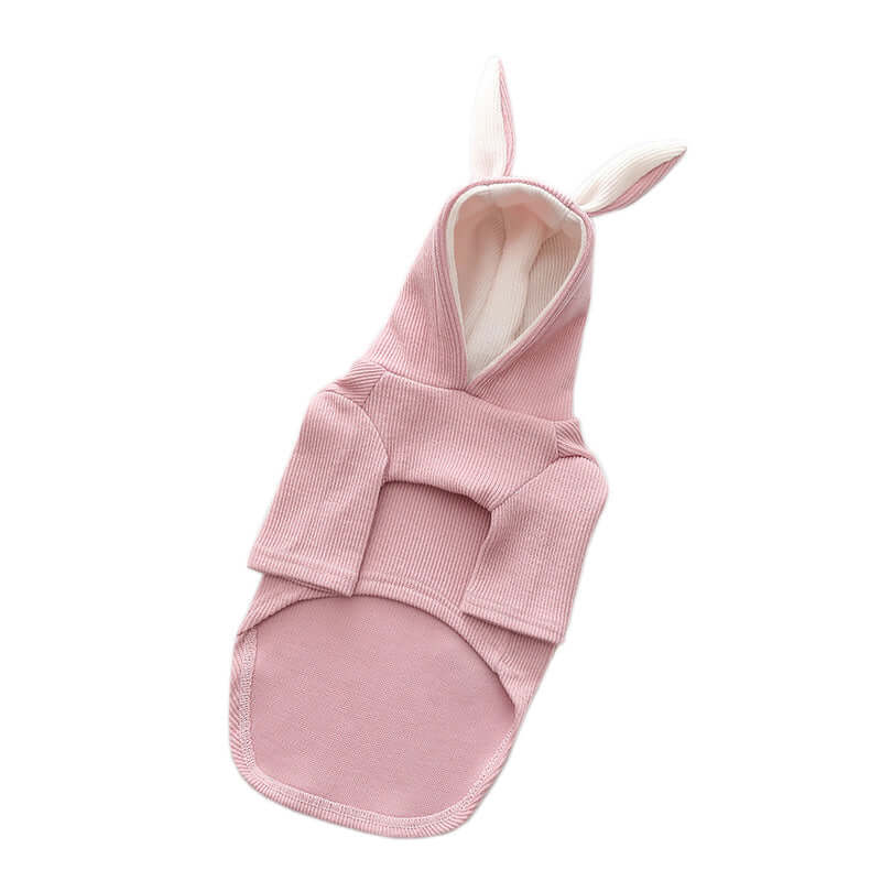 Pink baby swaddle with bunny ears on a white background