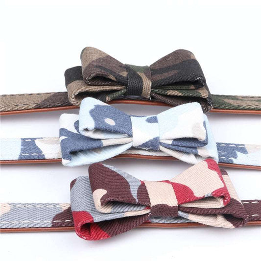 Three camouflage bow tie cat collars in green, blue, and multicolor designs displayed on a white background.