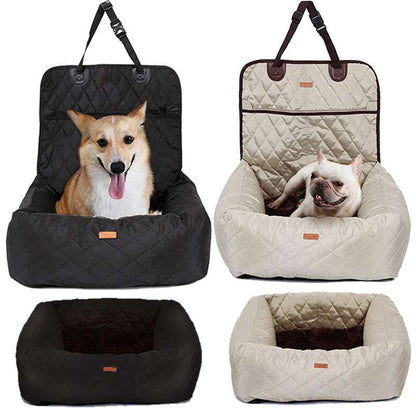 Black and beige foldable dog car seat and travel bed with small dogs sitting inside.