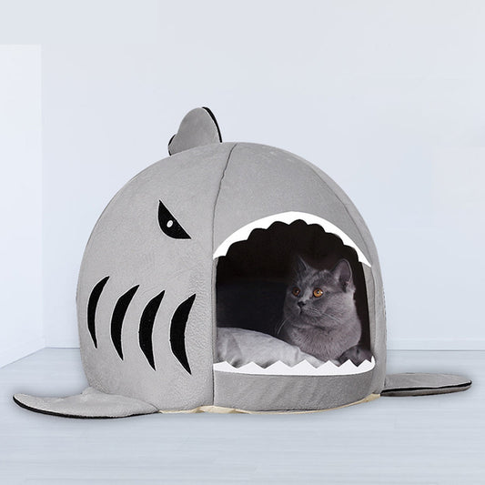 Cozy gray shark-shaped pet bed for cats and small dogs, featuring a soft cotton interior and playful design.