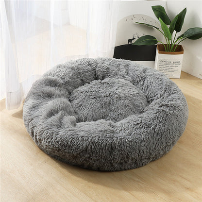 Donut-shaped cat bed ideal for curling up and snuggling