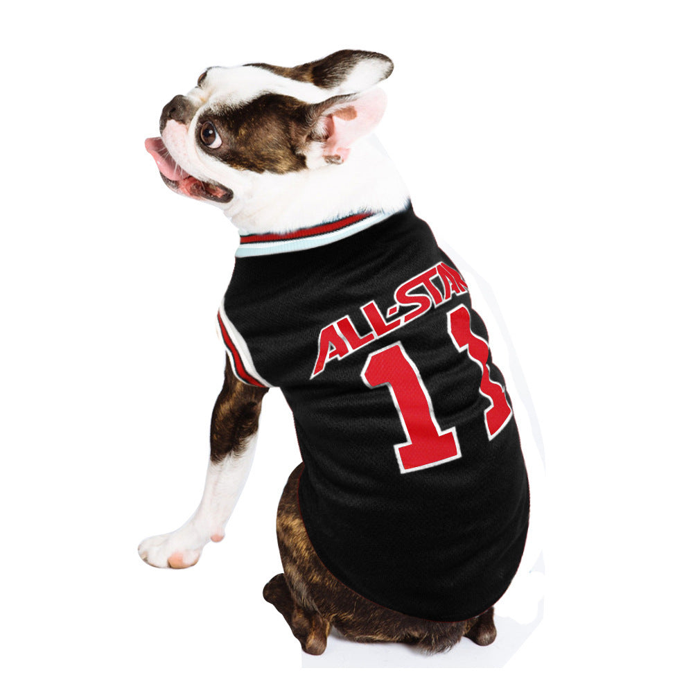 Dog wearing a black jersey with red and white text on a white background