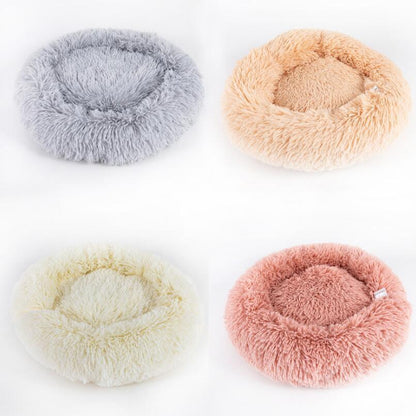 Soft white plush round cat and dog bed with cozy high walls