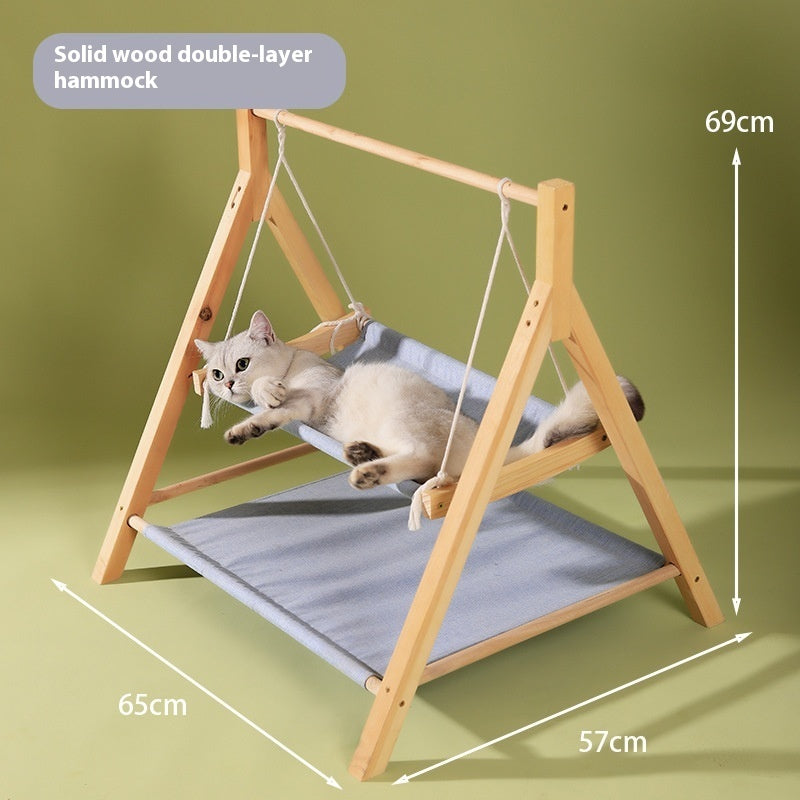 Cat relaxing on double-decker hammock bed in minimalist home setting
