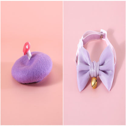 Golden shimmer bow for cats with an attached bell, festive and elegant for holidays like Christmas or New Year.