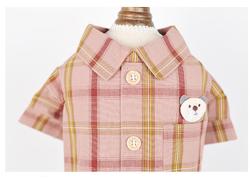 Plaid shirt with bear design and buttons on a white background