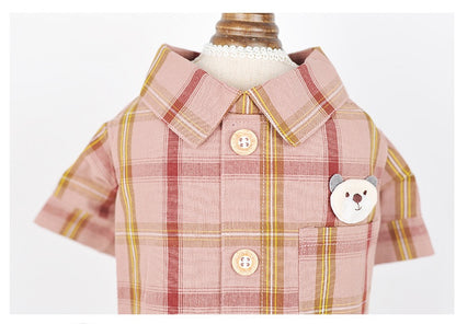 Plaid shirt with bear design and buttons on a white background