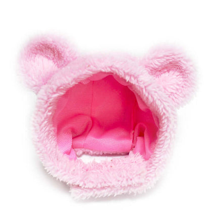 Kitten modeling a pink bear costume hat for pets
