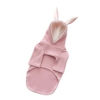 Pink baby swaddle with bunny ears on a white background