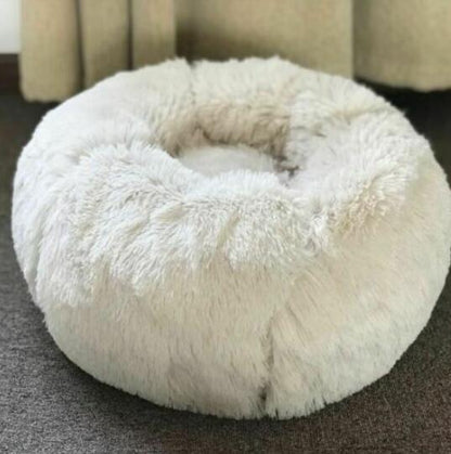 Anti-anxiety cat bed with soft plush material and raised rim