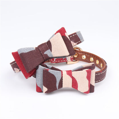 Set of three PU leather camouflage cat collars with bow ties in green, blue, and multicolor laid flat against a white background.