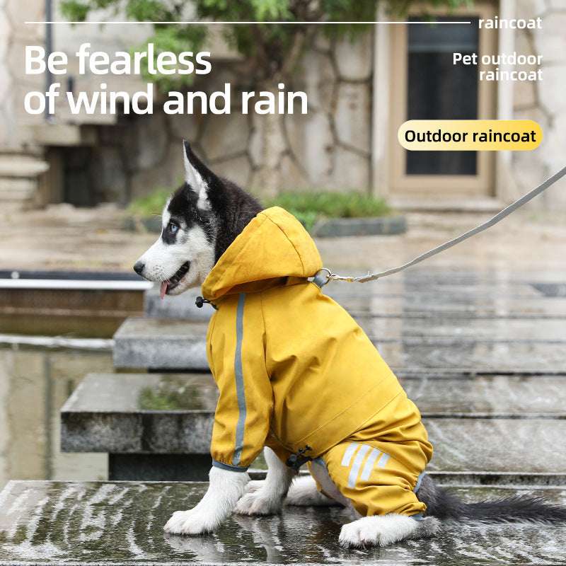 Husky dog wearing a yellow waterproof raincoat sitting near a puddle