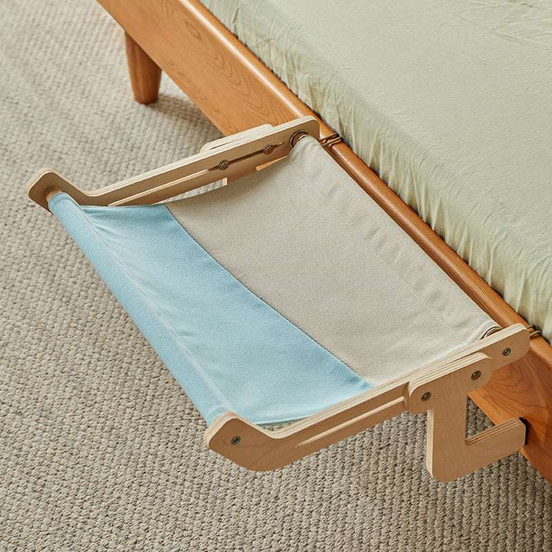 Elegant wooden frame cat bed with cozy fabric and a relaxed white cat.