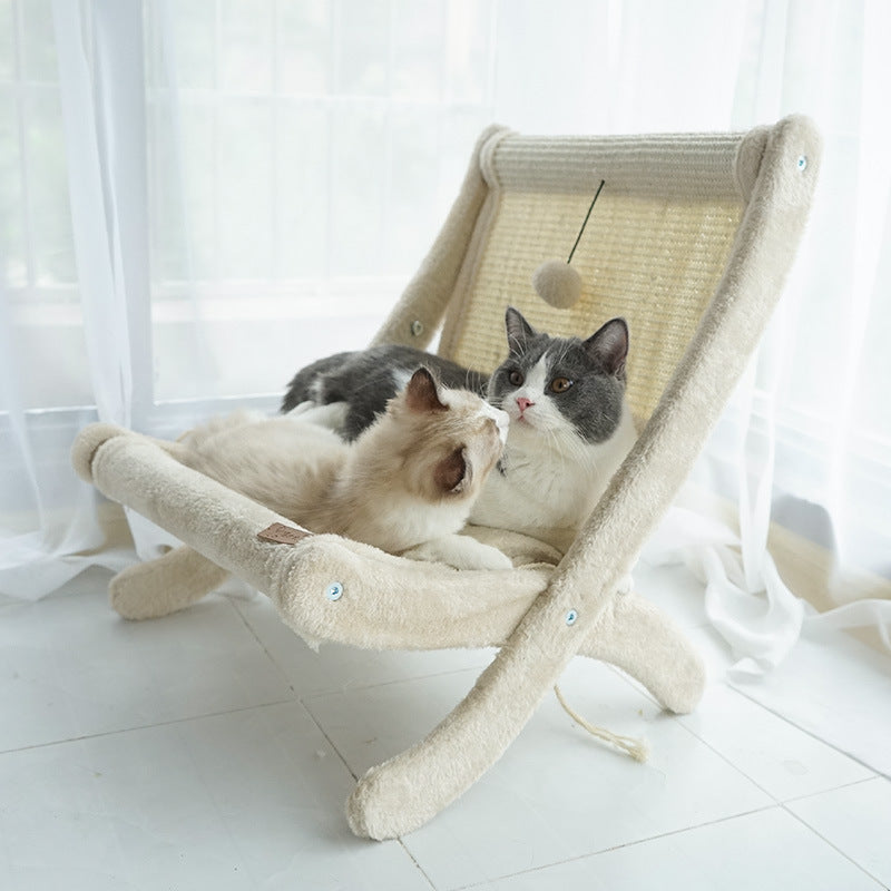 Chubby cat enjoying a peaceful nap on a beige furry cat lounger placed in a bright indoor corner.